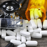 Stethoscope, drugs, and syringe 